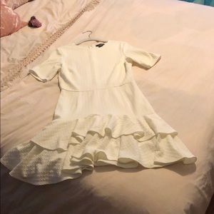 White mini mermaid dress with bottom ruffle